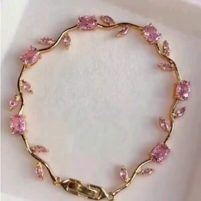 Tulip Bracelet features pink crystal stones set in a gold-plated