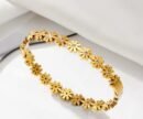 Daisy bangle is crafted from tarnish-resistant stainless steel and features small synthetic zirconia crystals in the center of each flower