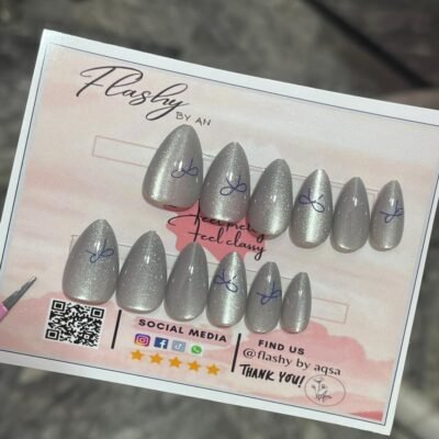15tips cat eye nails in grey color with a beautiful blue bow