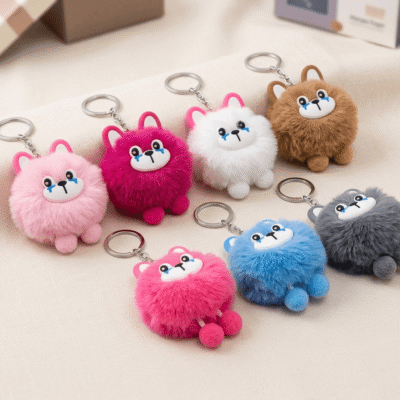 plush animal keychains featuring fluffy pompom bodies