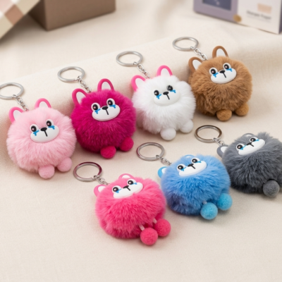 plush animal keychains featuring fluffy pompom bodies