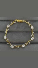 Tulip Bracelet features white crystal stones set in a gold-plated