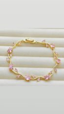 Tulip Bracelet features pink crystal stones set in a gold-plated