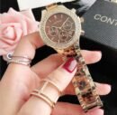 Contena luxury quartz watch features a brown dial and a crystal-encrusted bezel