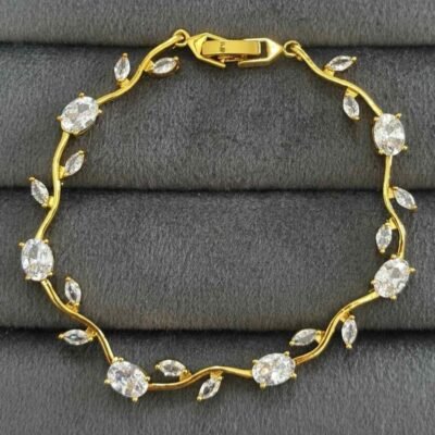 Tulip Bracelet features white crystal stones set in a gold-plated